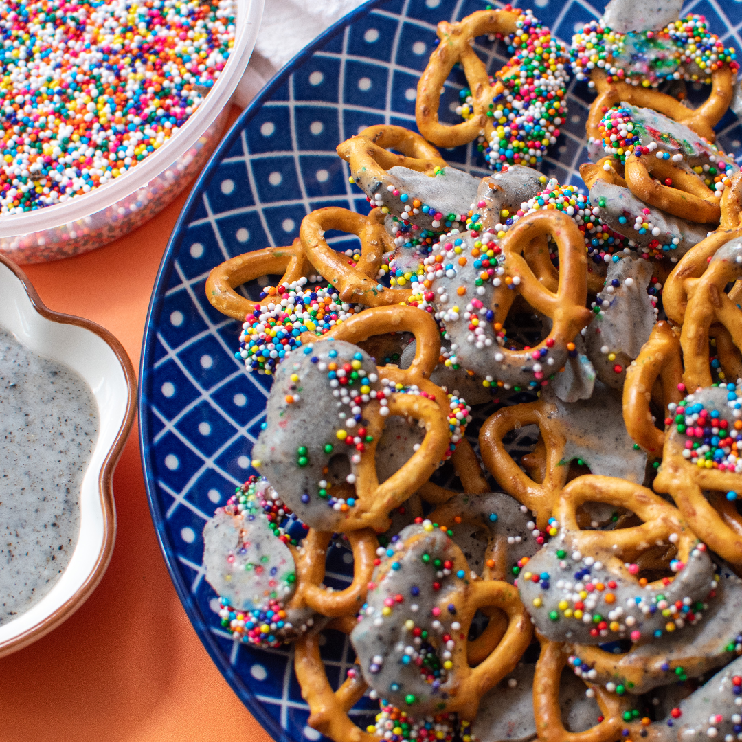 Yogurt Pretzels with rainbow sprinkles in a bowl.