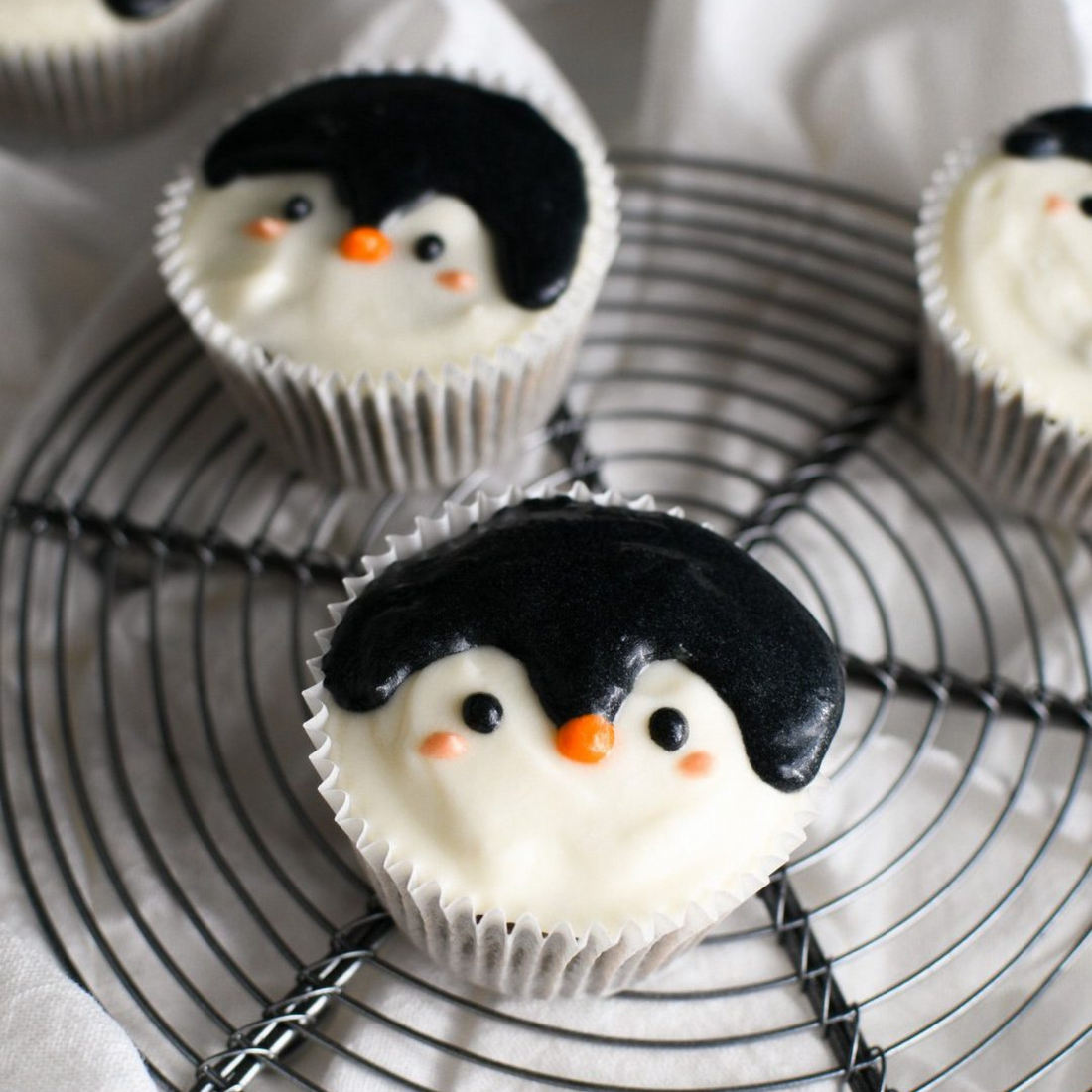 Black sesame Oreo cupcakes with penguin design