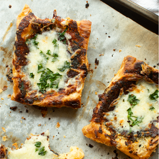 Savory garlic puff pastry with cheese on top